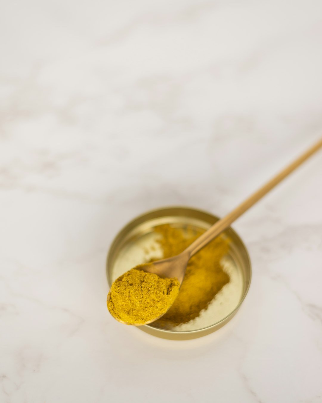 An image showcasing the vibrant color and texture of Turmeric, embodying its essence as a superfood.